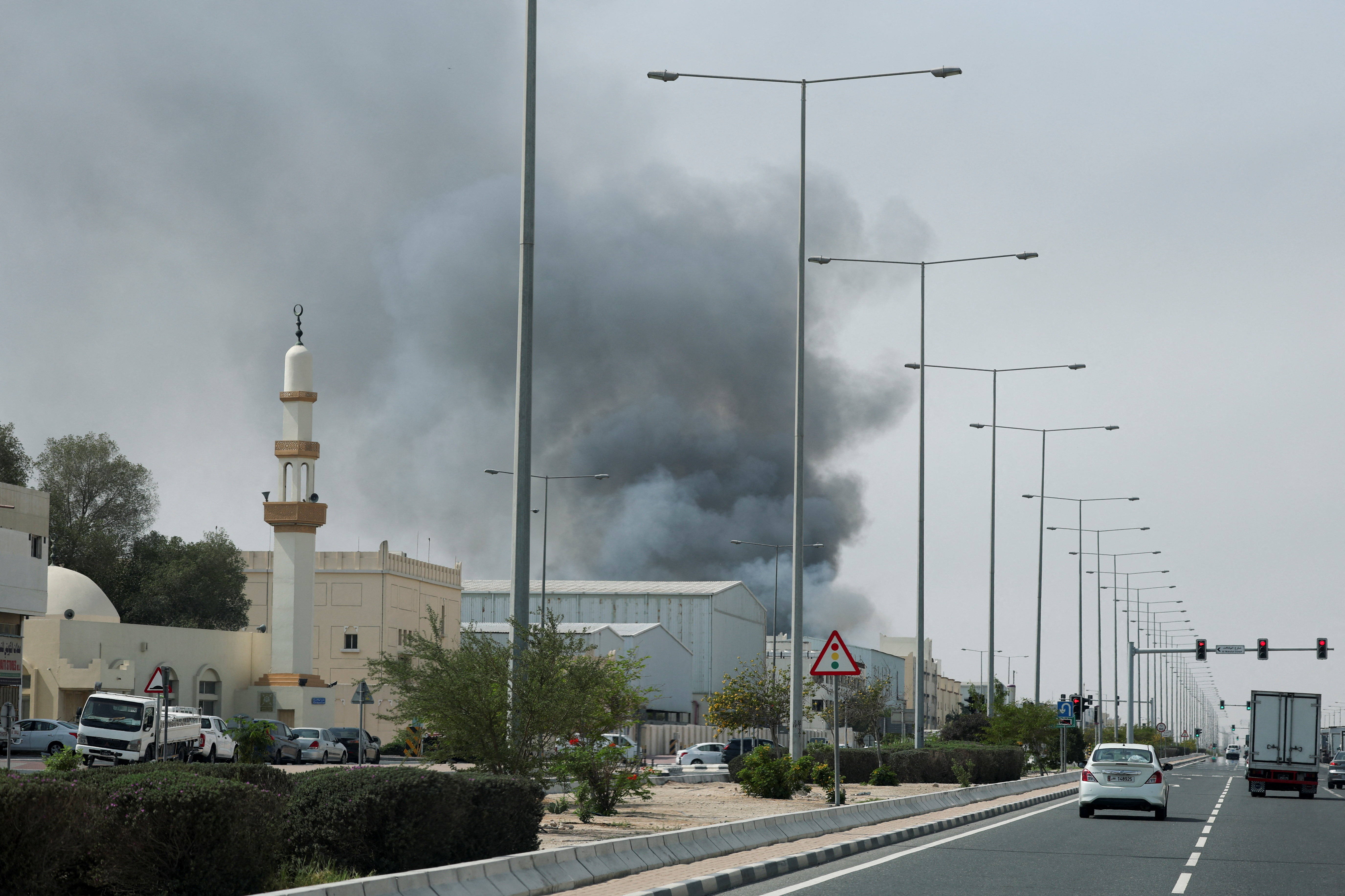 Smoke rises after reported Iranian missile attacks, following United States and Israel strikes on Iran, as seen from Doha