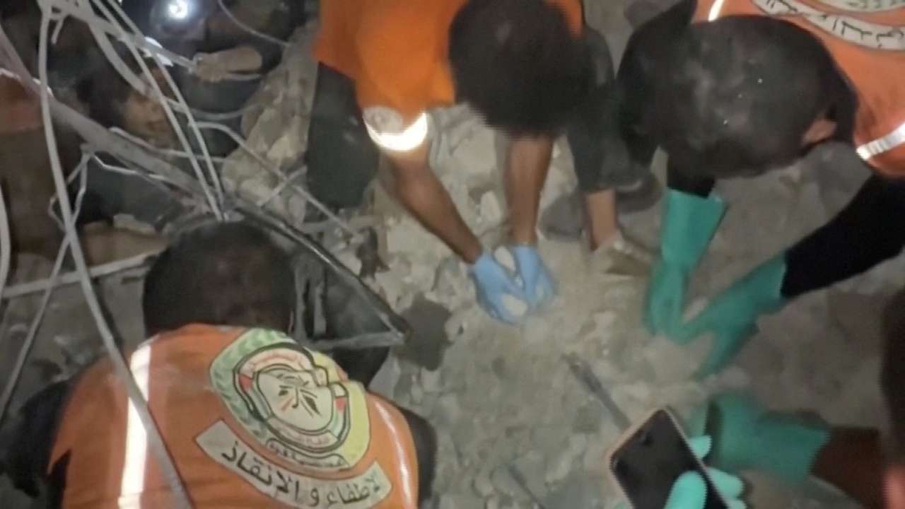 Rescuers work to free people trapped in rubble after an Israeli strike in Gaza City
