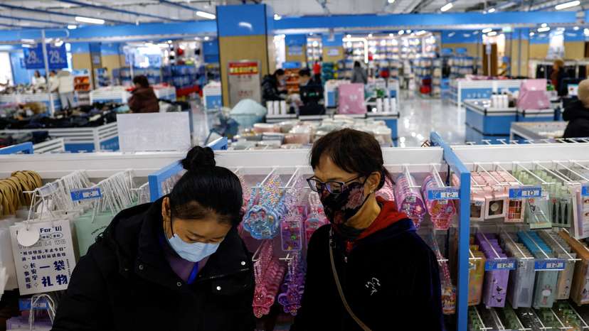 FILE PHOTO: Customers shop at the Wankelai store in Beijing