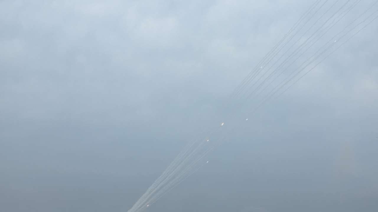 Smoke trails are seen as a salvo of rockets are launched from the Gaza Strip into Israel, as seen from southern Israel