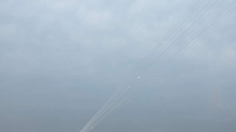 Smoke trails are seen as a salvo of rockets are launched from the Gaza Strip into Israel, as seen from southern Israel