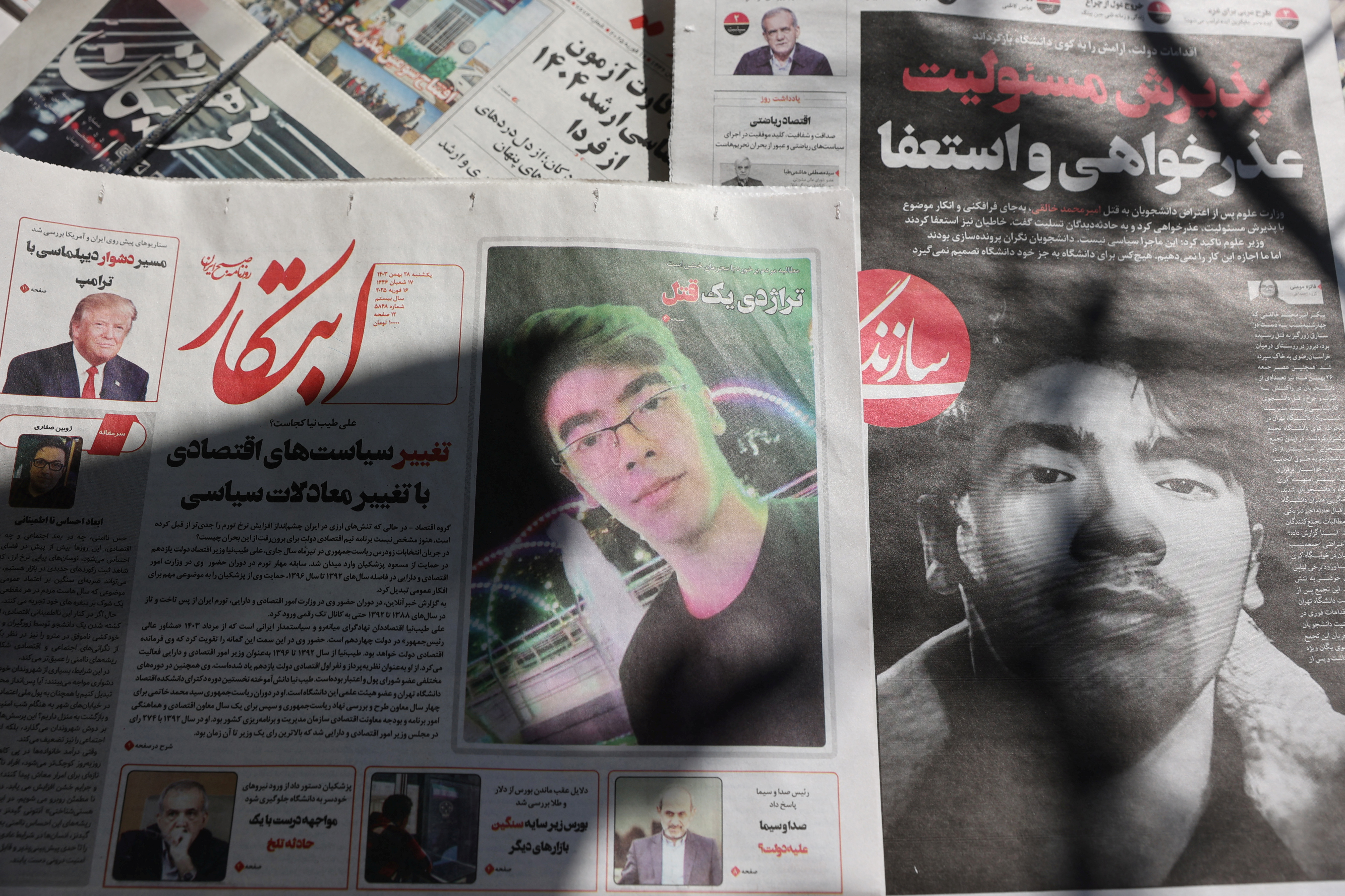Iranian newspapers with photos of Amir Mohammad Khaleqi are seen in Tehran