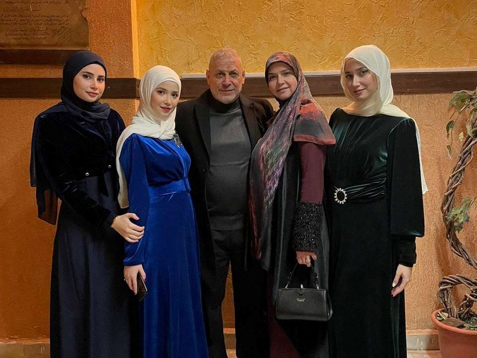A photo shows members of the Gharib family who were killed in an Israeli strike in a suburb of Tyre on Monday