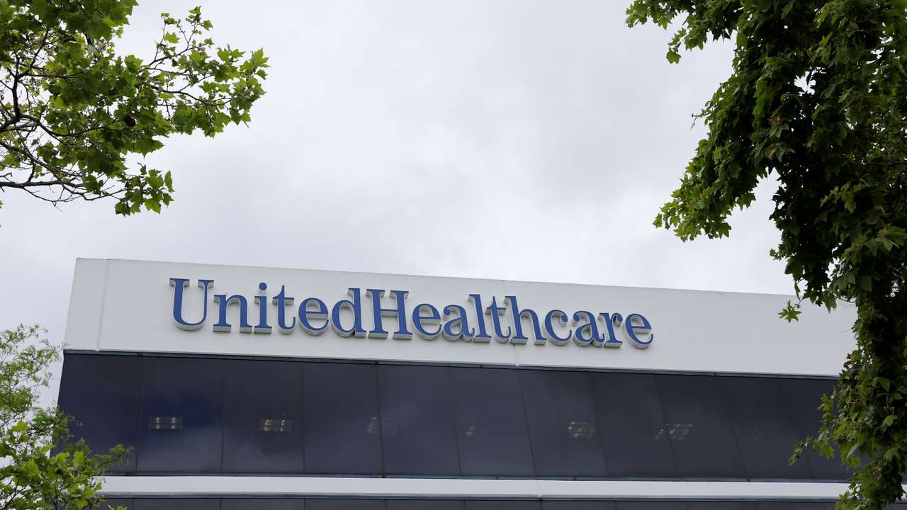 The corporate logo of the UnitedHealth Group appears on the side of one of their office buildings in Santa Ana, California