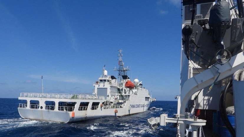 A China Coast Guard vessel manoeuvres near Philippine Coast Guard vessel BRP Teresa Magbanua near Scarborough Shoal in the South China Sea