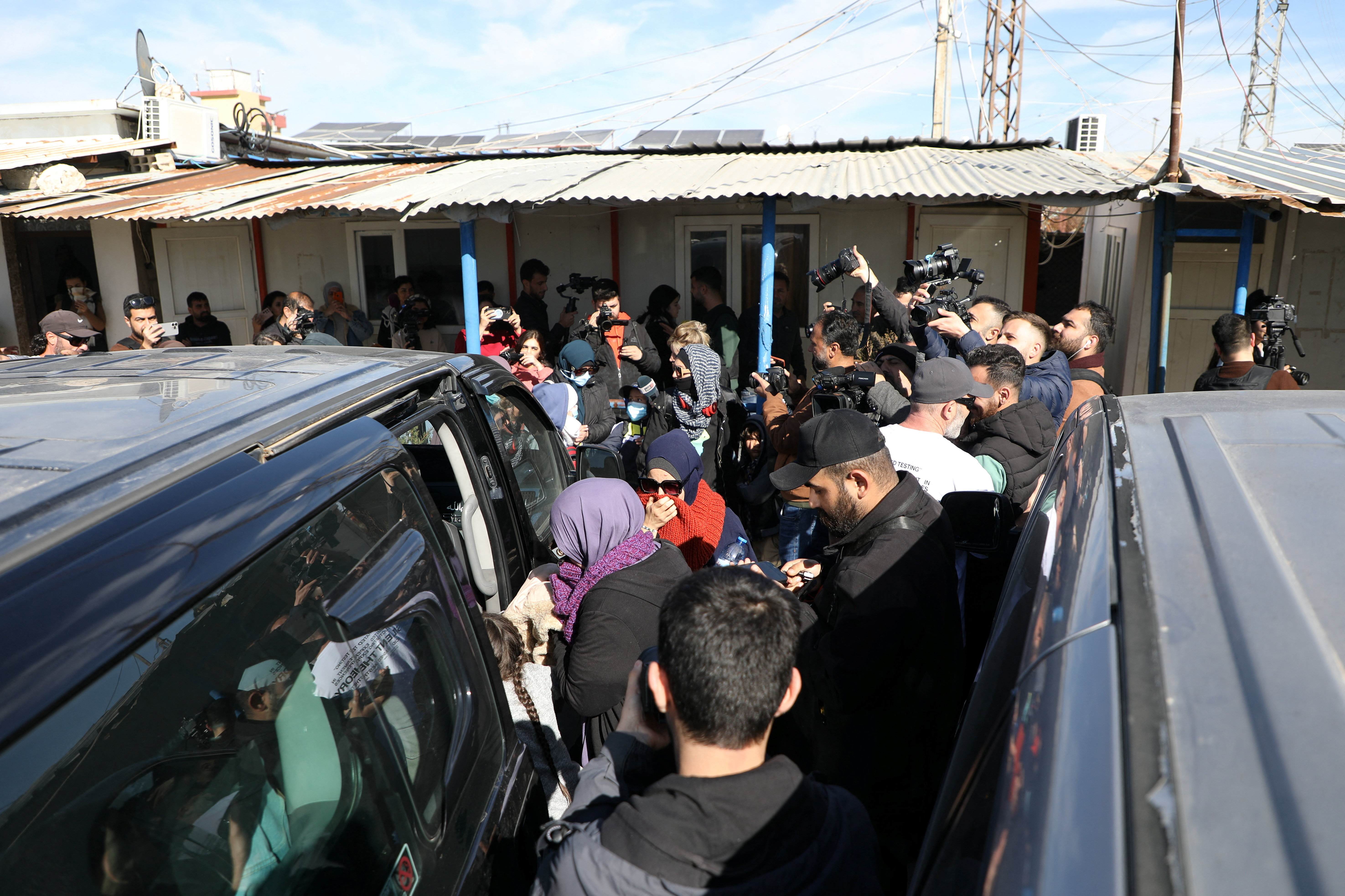 Australian families believed to be linked to the Islamic State militants leave Roj camp near Derik