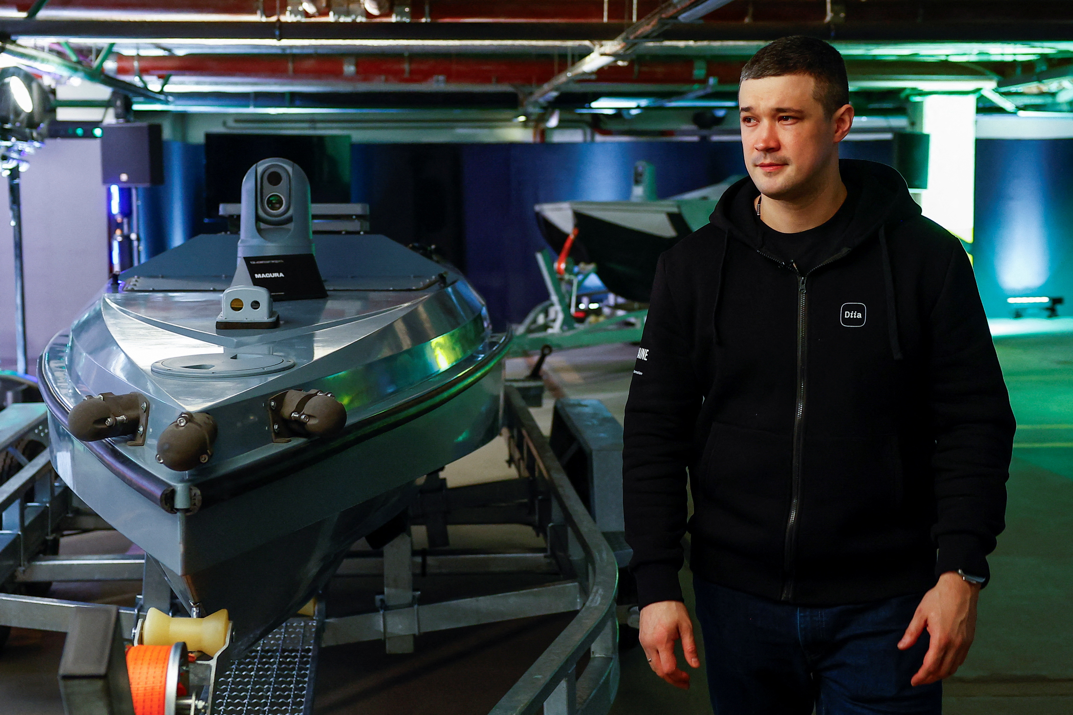 Minister of Digital Transformation of Ukraine Fedorov walks next to Magura unmanned marine vehicles during an interview with Reuters in Kyiv