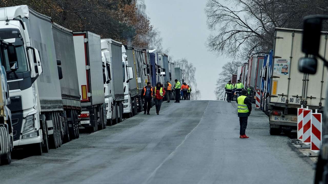 FILE PHOTO: FILE PHOTO: Ukrainian trucks are parked near the Poland-Ukraine border, near the village of Korczowa, Poland