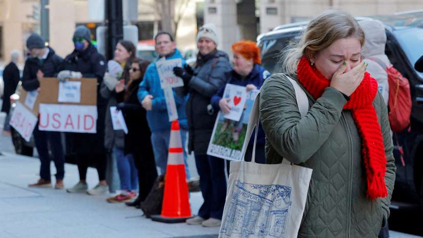 FILE PHOTO: Recently fired USAID staff leave the office in Washington