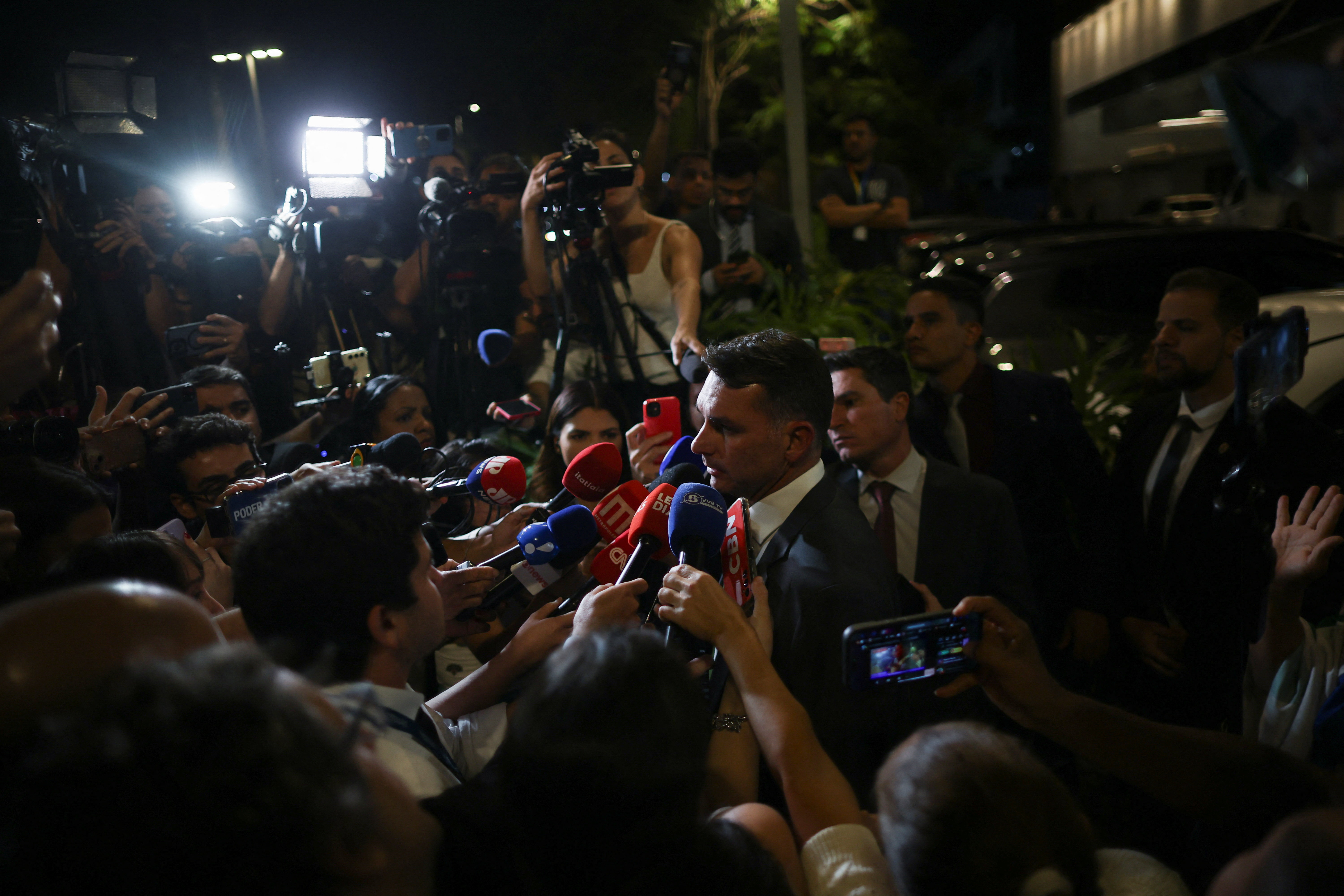 Brazil's Bolsonaro taken to hospital after feeling sick, son says