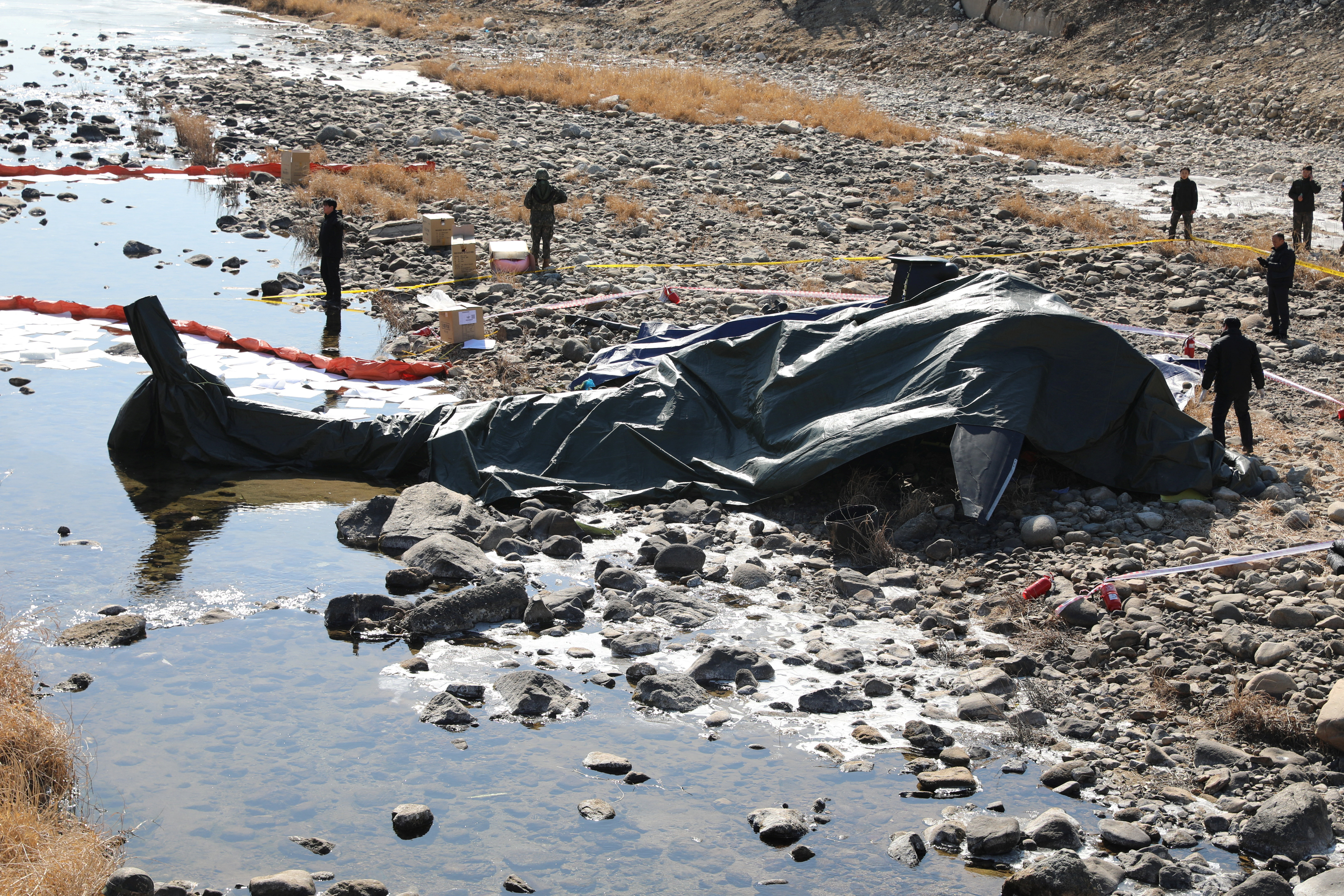 South Korean military officials secure the site where an AH-1S Cobra attack helicopter crashed in Gapyeong