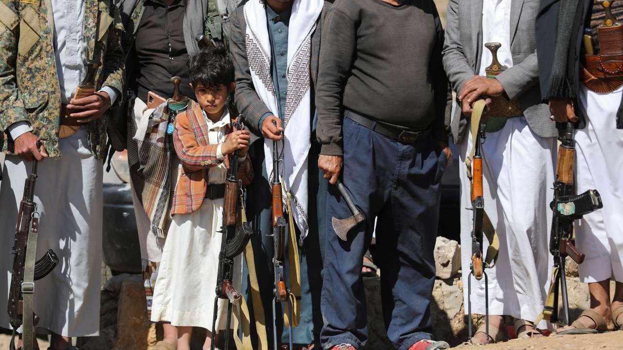 Boy holds a rifle as he takes part in a pro-Palestinian protest by Houthi supporters in Sanaa