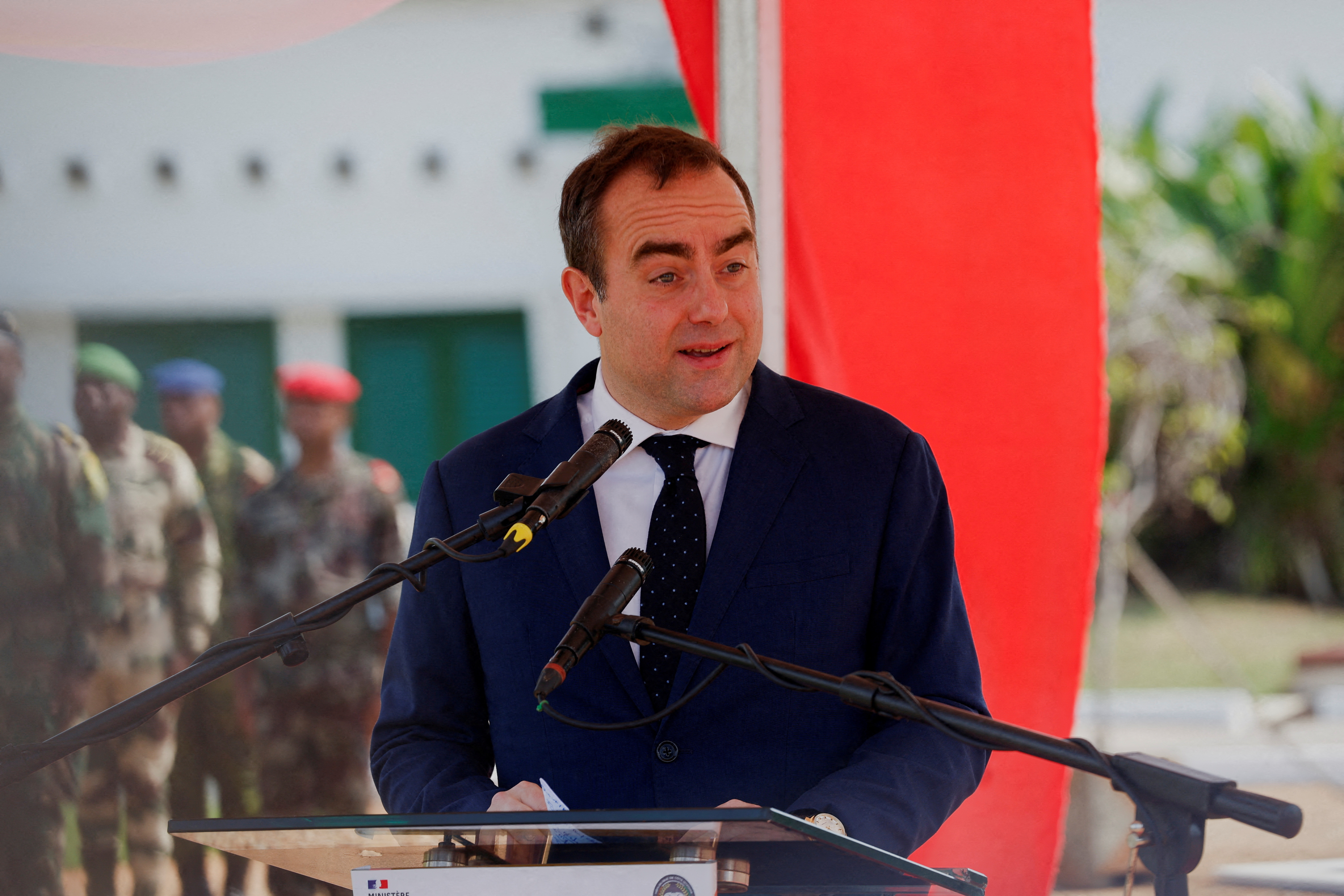 French Defense Minister Sebastien Lecornu speaks during the ceremony marking the departure of French troops from Ivory Coast
