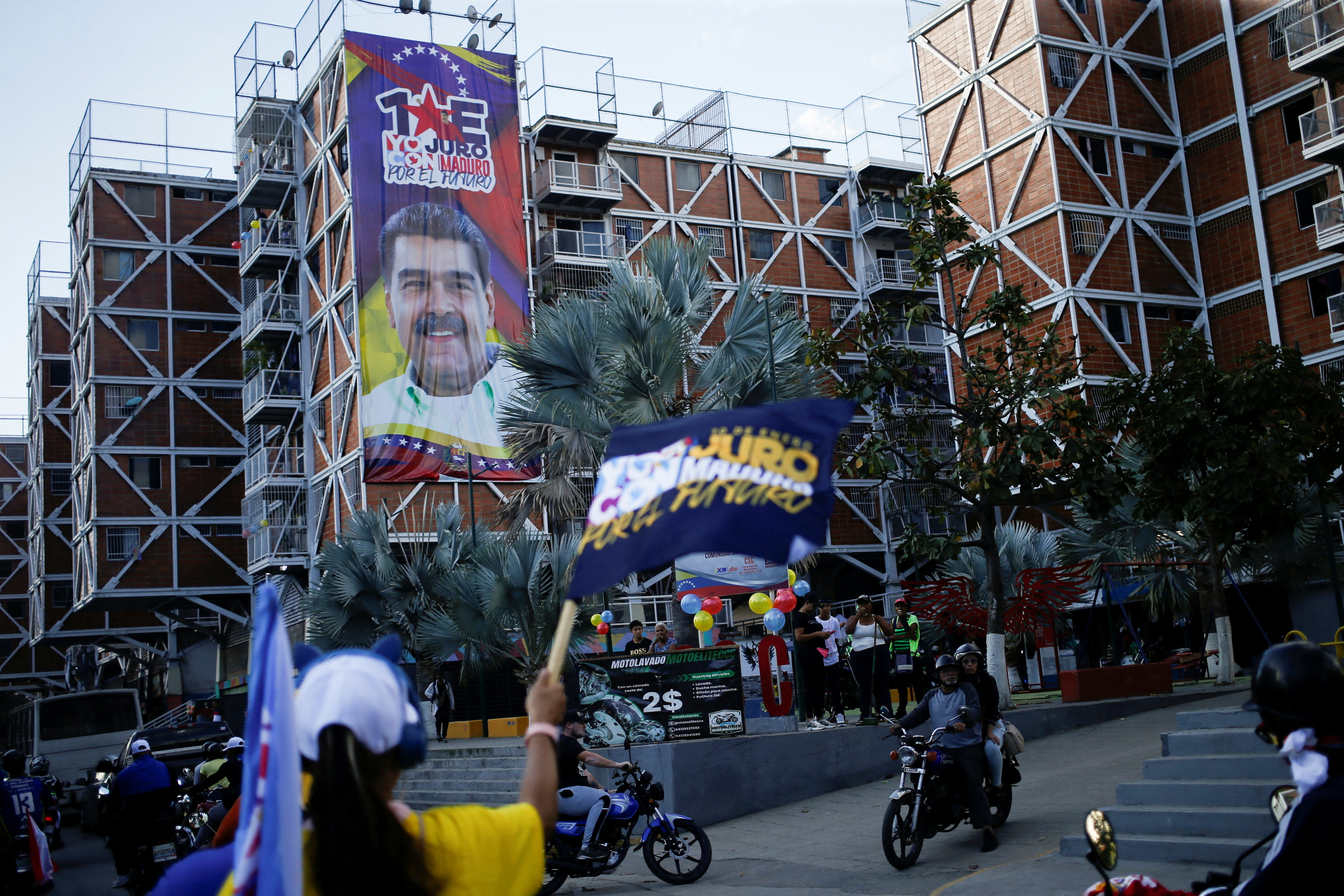 FILE PHOTO: Signs showing Venezuela's President Nicolas Maduro and pro-Maduro slogans, in Caracas