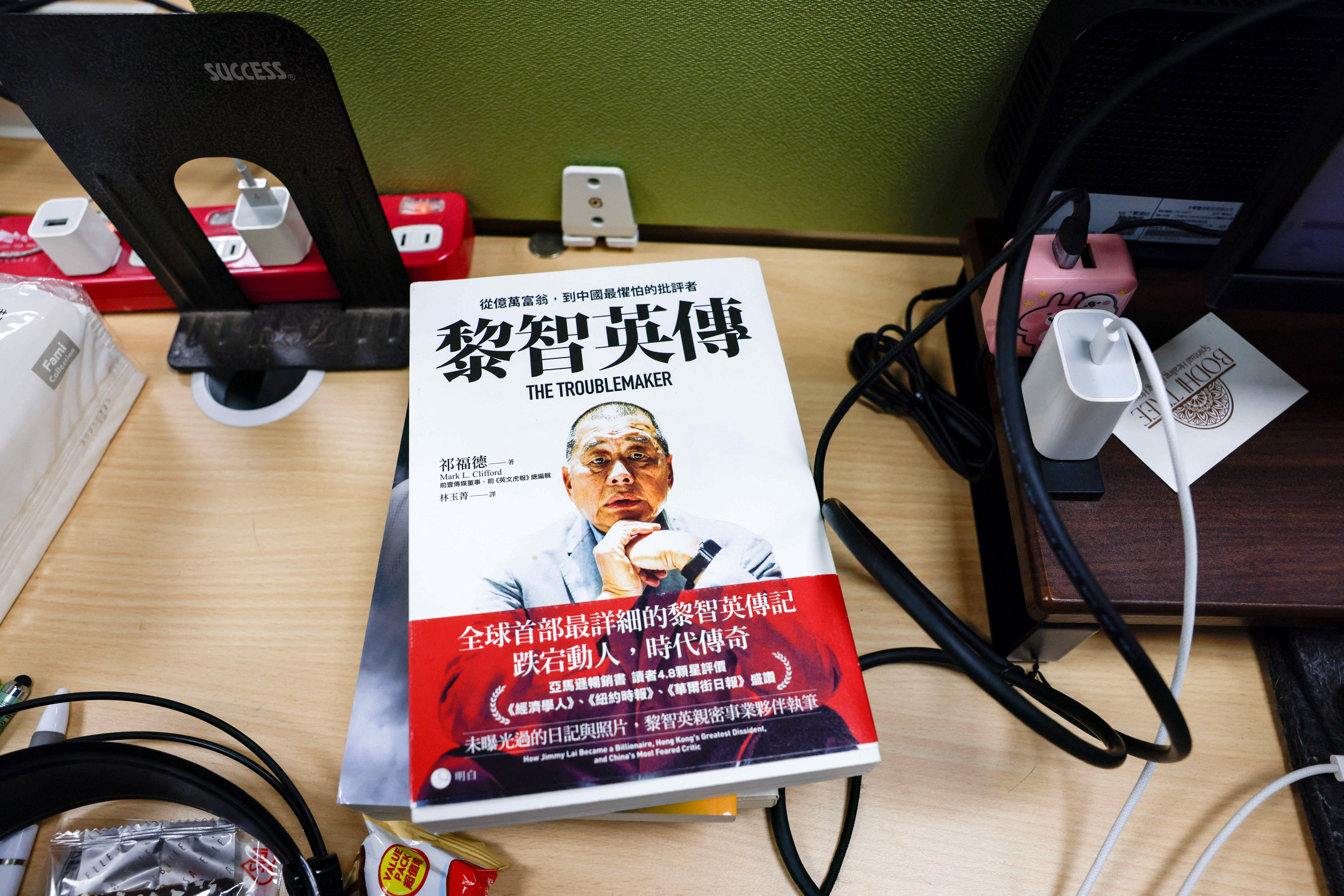 A book about Jimmy Lai on a table where former reporters of Apple Daily work in Taipei