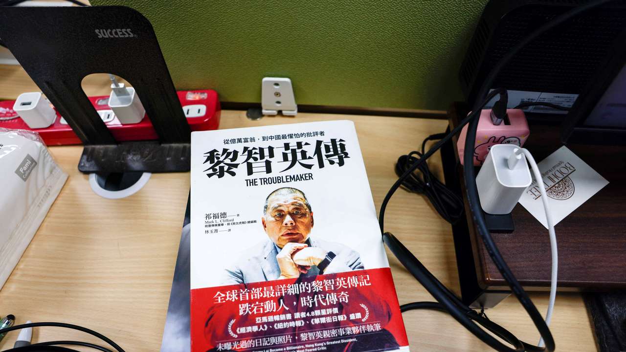 A book about Jimmy Lai on a table where former reporters of Apple Daily work in Taipei