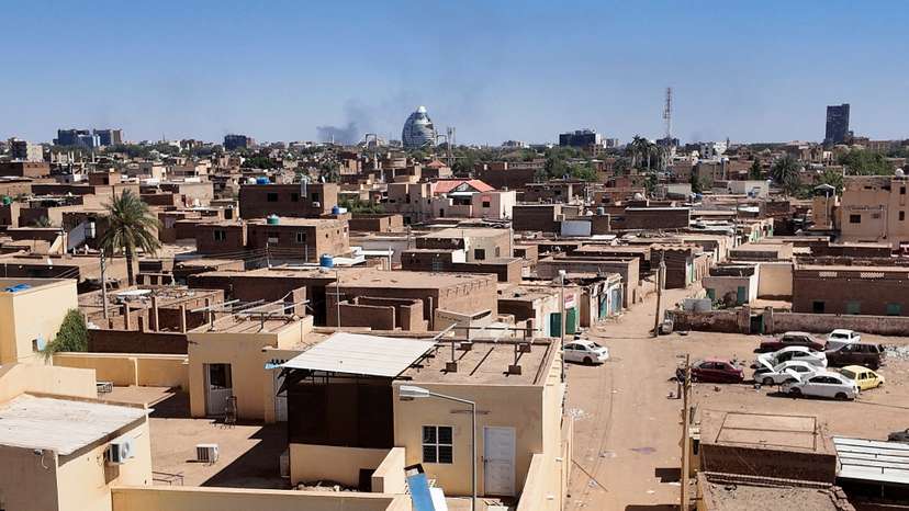 A general view of smoke rising over houses in Tuti Island