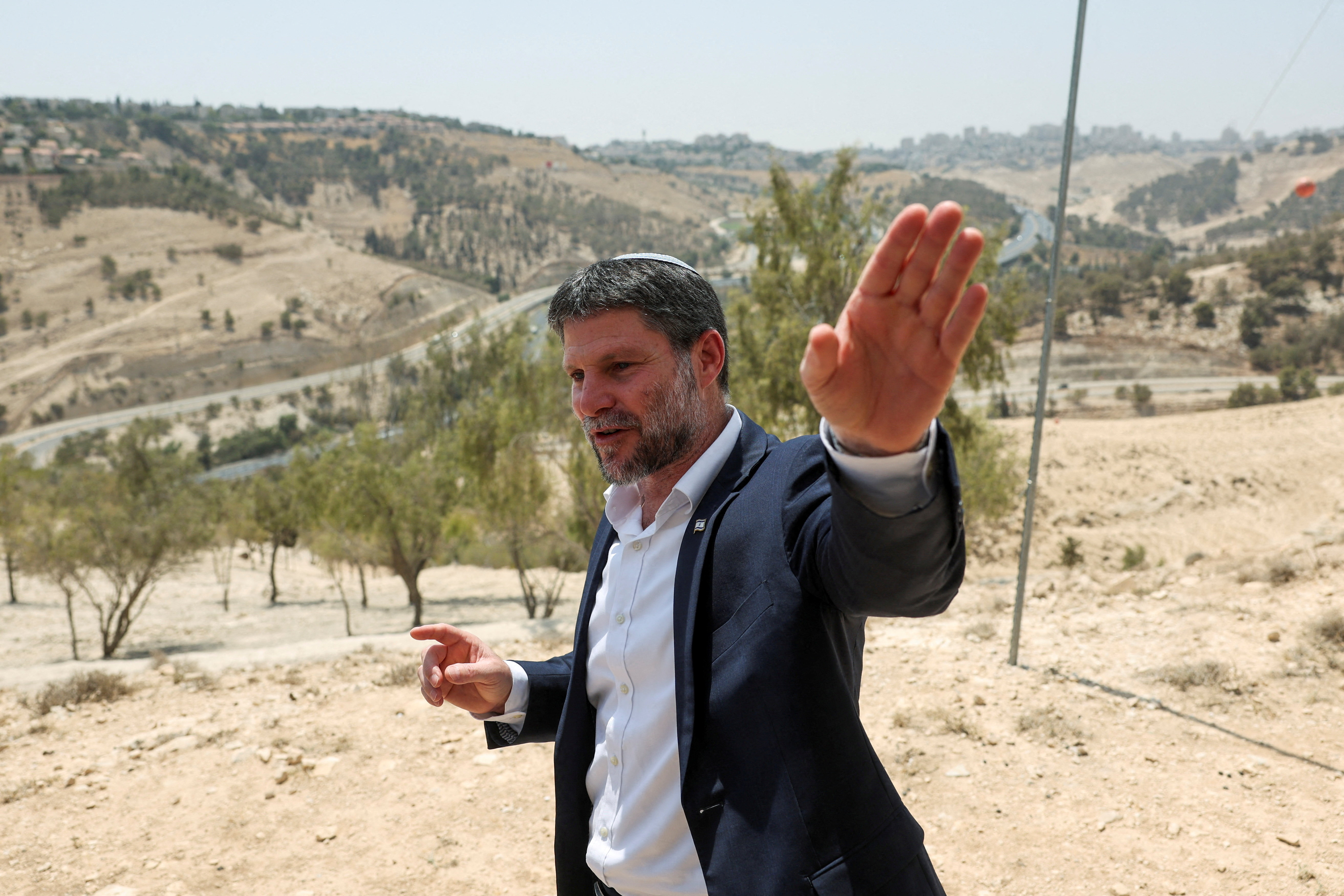 FILE PHOTO: Israeli Finance Minister Smotrich speaks at a press conference regarding settlements expansion, near the Israeli settlement of Maale Adumim