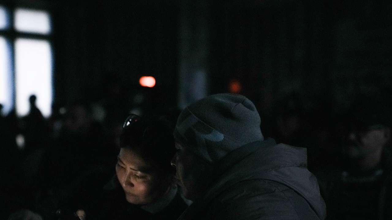 Relatives of miners gather at the Kostenko coal mine in Karaganda