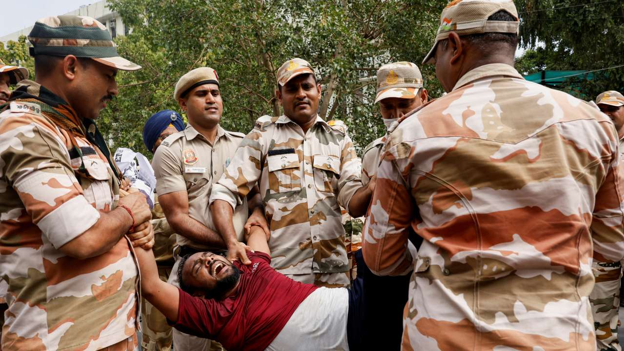 Students holding placards protest outside the Ministry of Education against the cancellation of the UGC-NET examination at New Delhi
