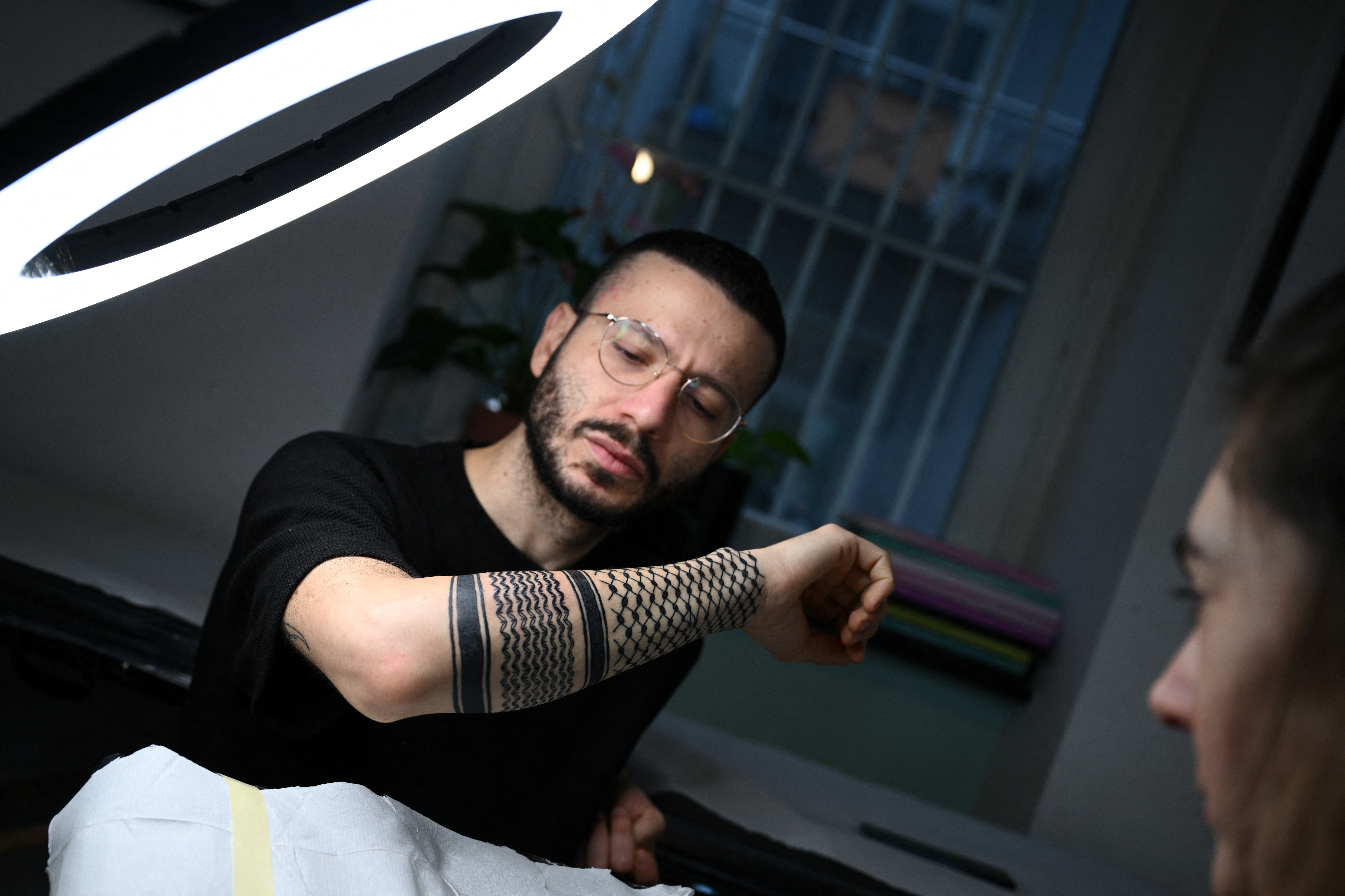 From a headdress to a tattoo, Keffiyeh rises as Palestinian solidarity symbol