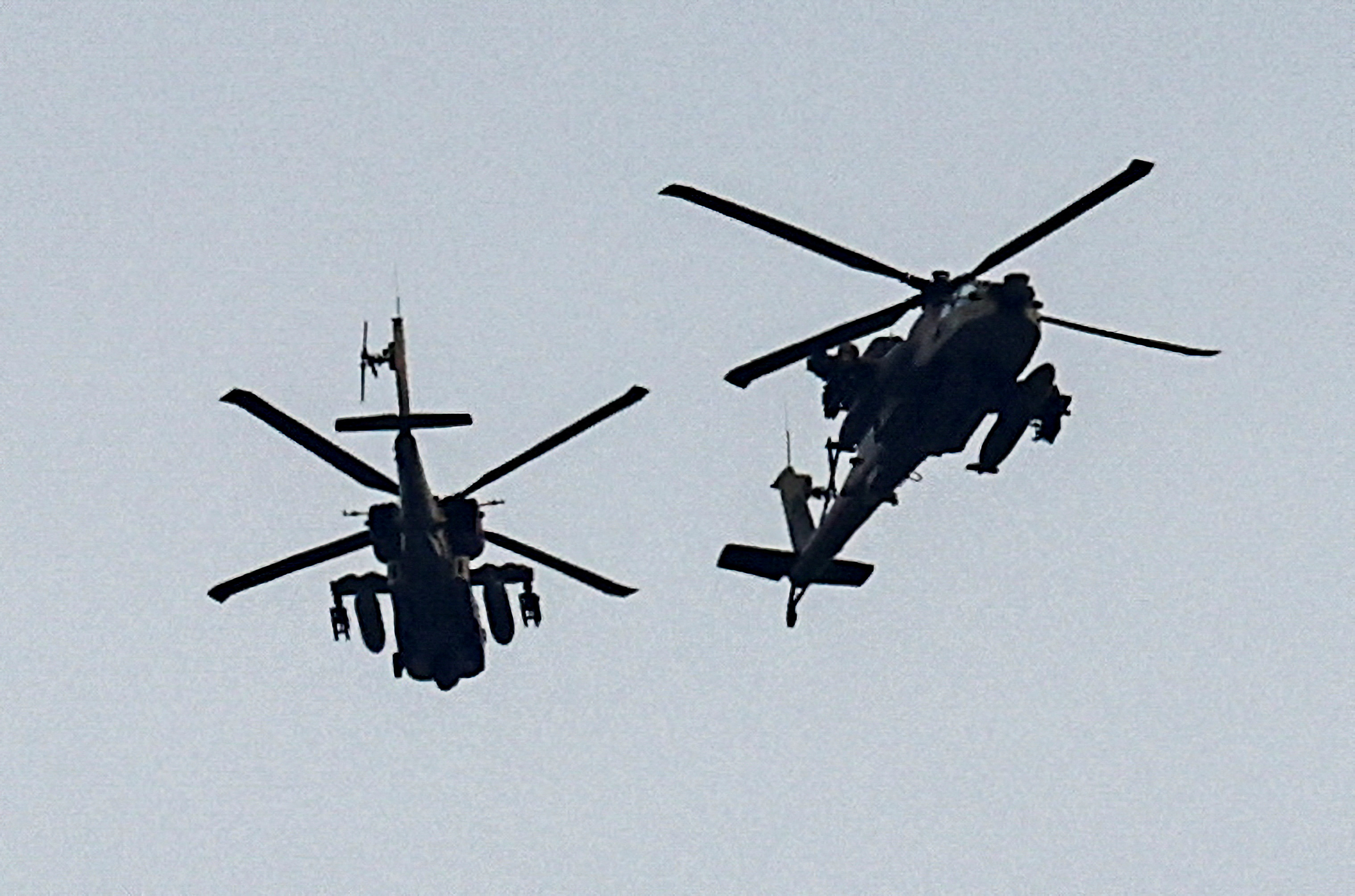 Israeli military helicopters fly near the Israel-Gaza border, amid the ongoing conflict between Israel and the Palestinian Islamist group Hamas, as seen from southern Israel