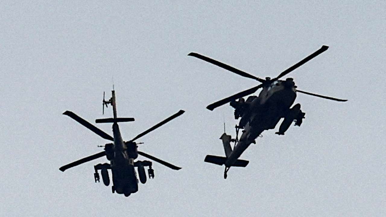 Israeli military helicopters fly near the Israel-Gaza border, amid the ongoing conflict between Israel and the Palestinian Islamist group Hamas, as seen from southern Israel