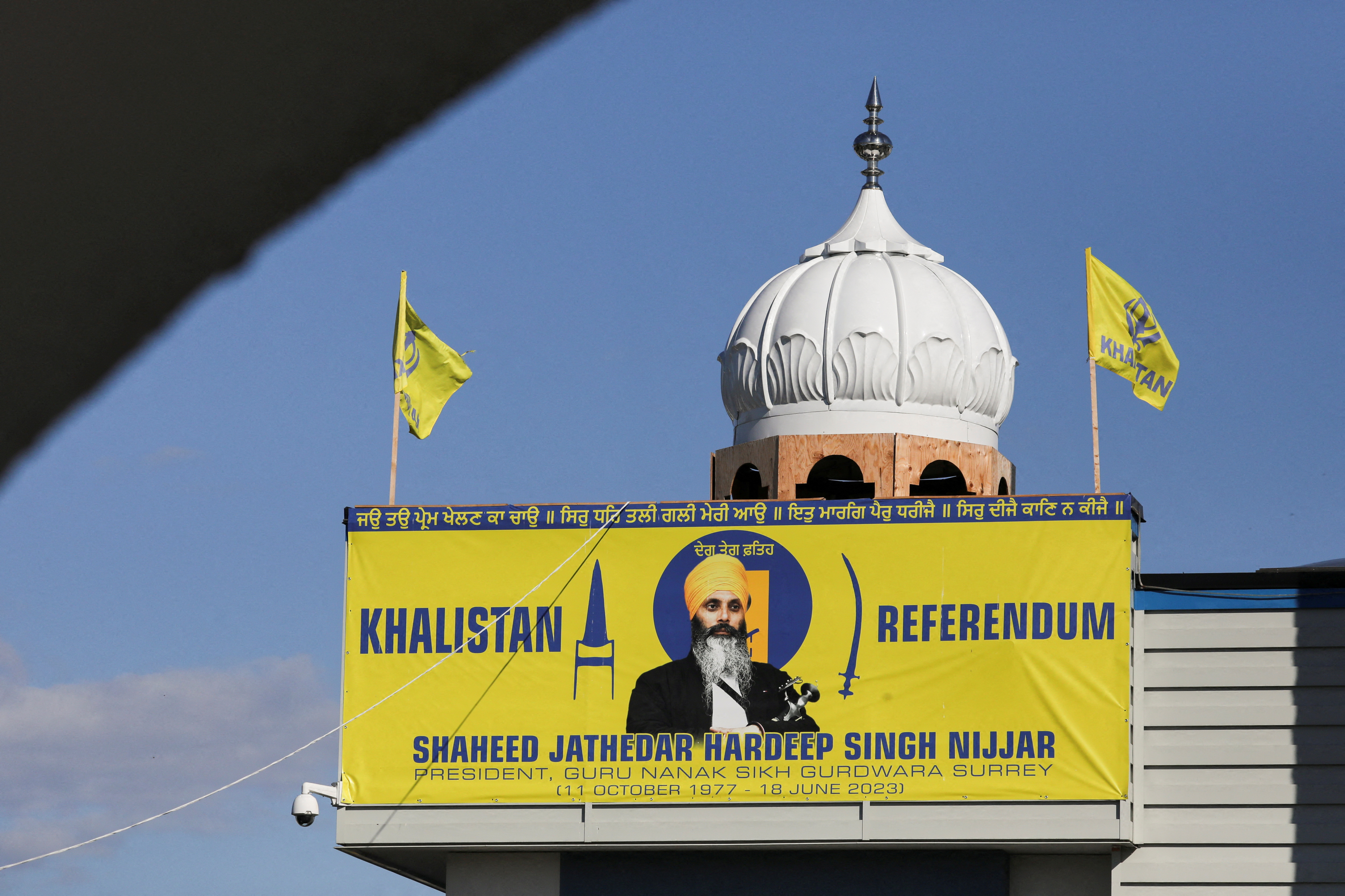FILE PHOTO: A banner with the image of Sikh leader Hardeep Singh Nijjar is seen at the Guru Nanak Sikh Gurdwara temple, site of his June 2023 killing, in Surrey