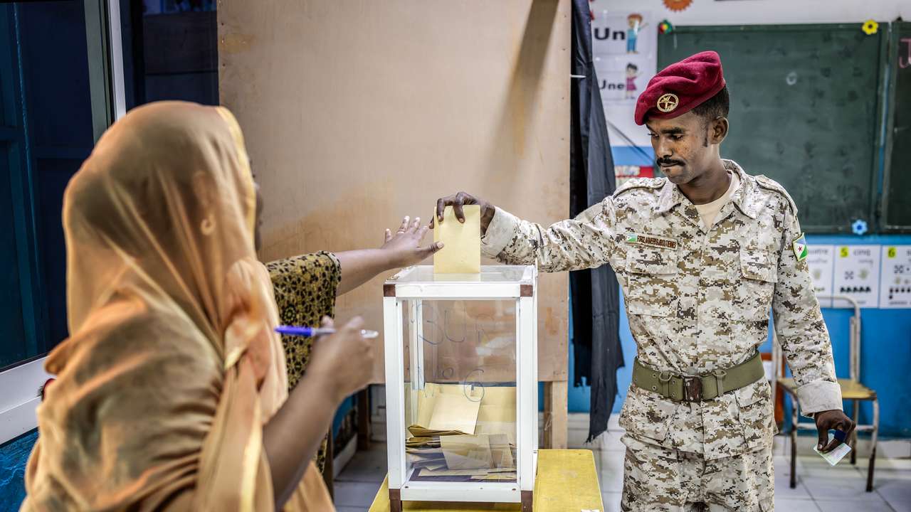 A member of the Djiboutian army casts his vote at a primary school serving as a polling station in Djibouti, on April 10, 2026, during the 2026 Djiboutian presidential elections. (Photo by Luis TATO / AFP)