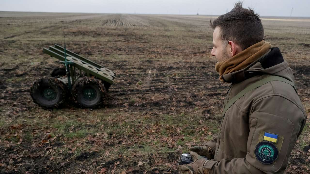 FILE PHOTO: A serviceman of the National Guard of Ukraine operates a mine-laying unmanned ground vehicle in Kharkiv region