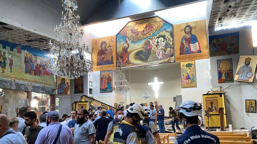 People and civil defence members inspect the damage after a blast rocked the Mar Elias Church in the Dweila neighbourhood of Damascus