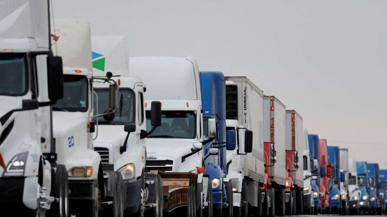 FILE PHOTO: Trucks wait in line to cross into the United States near the border customs control at the World Trade Bridge, in Nuevo Laredo, Mexico, November 26, 2024. REUTERS/Daniel Becerril/File Photo