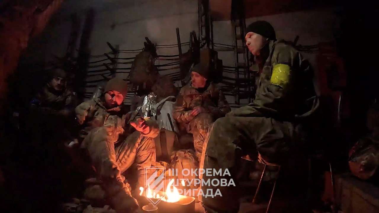 Ukrainian soldiers gather in a location given as Avdiivka, Donetsk Region