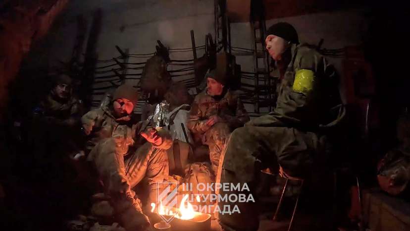 Ukrainian soldiers gather in a location given as Avdiivka, Donetsk Region