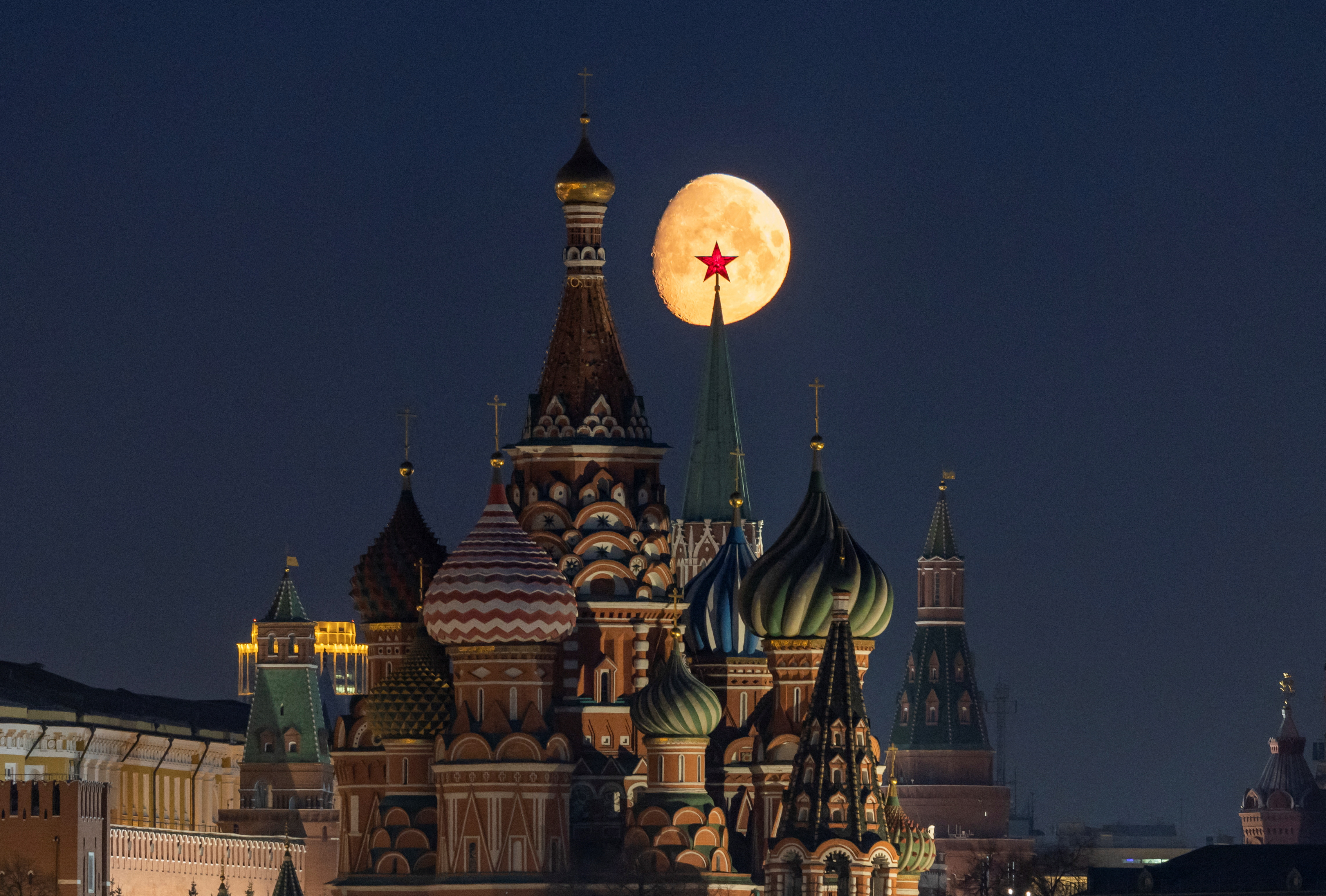 The moon rises over central Moscow