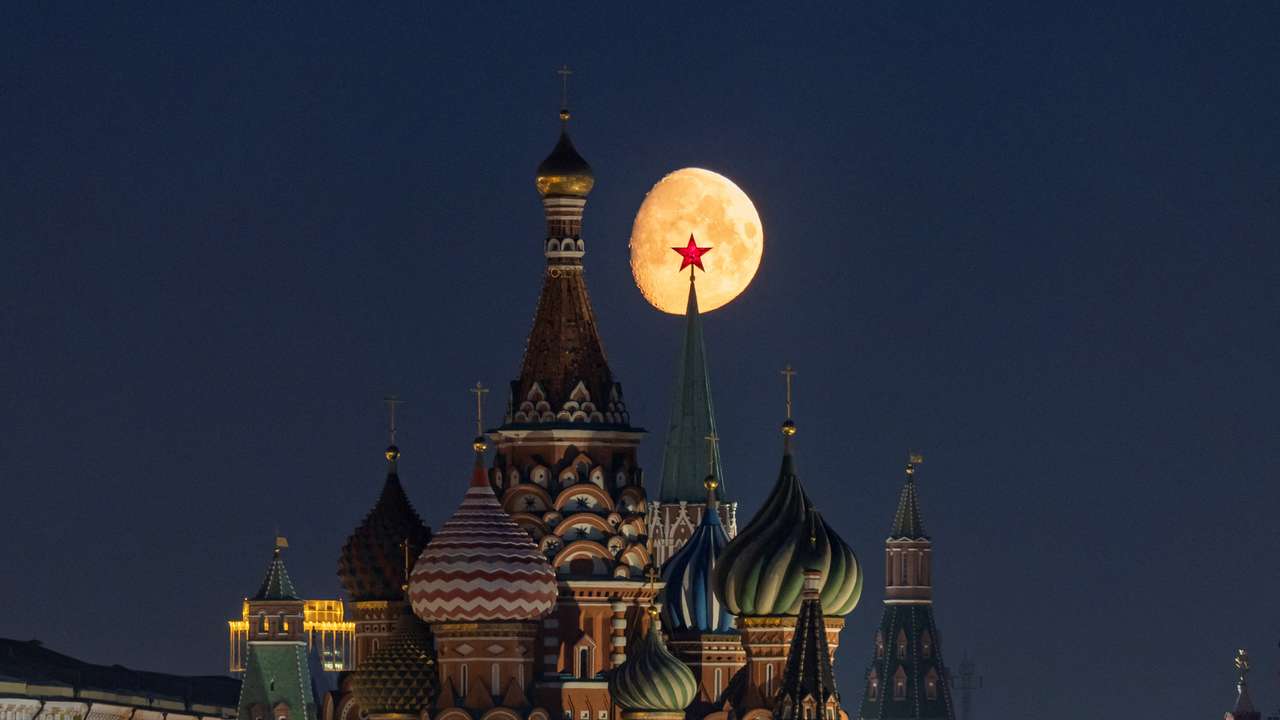 The moon rises over central Moscow