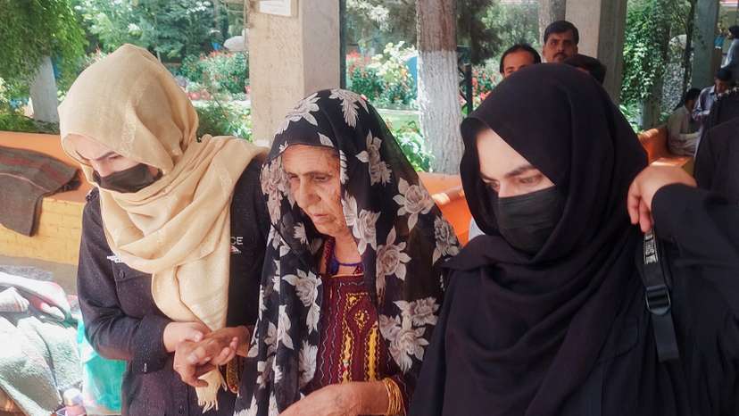 Policewomen escort Gul Jan Bibi, at a local court in Quetta