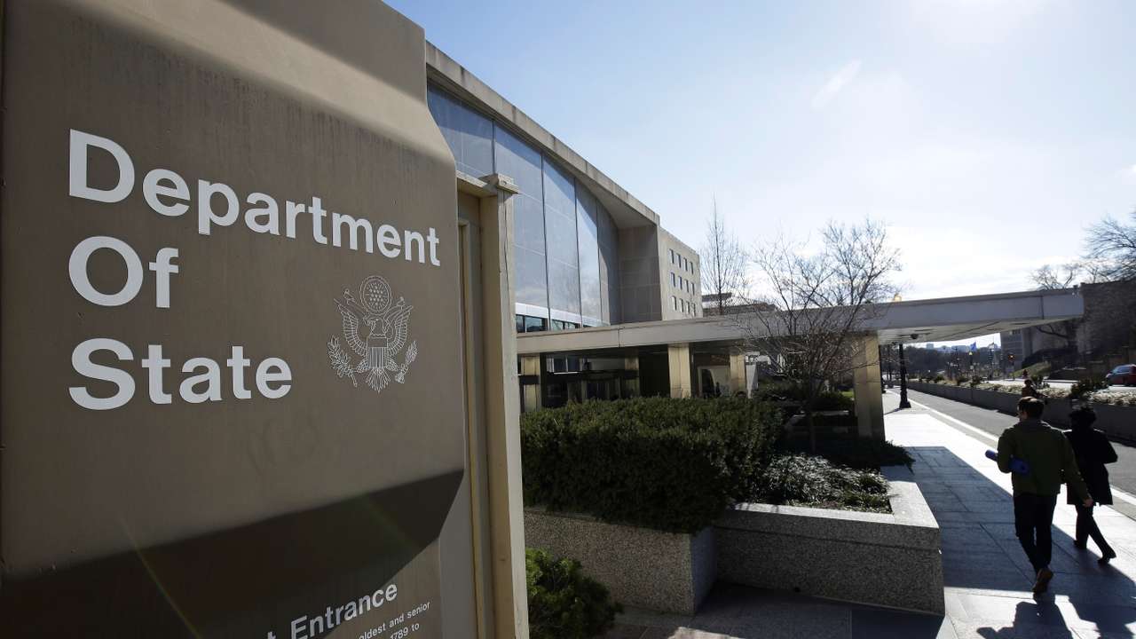 People enter the State Department Building in Washington