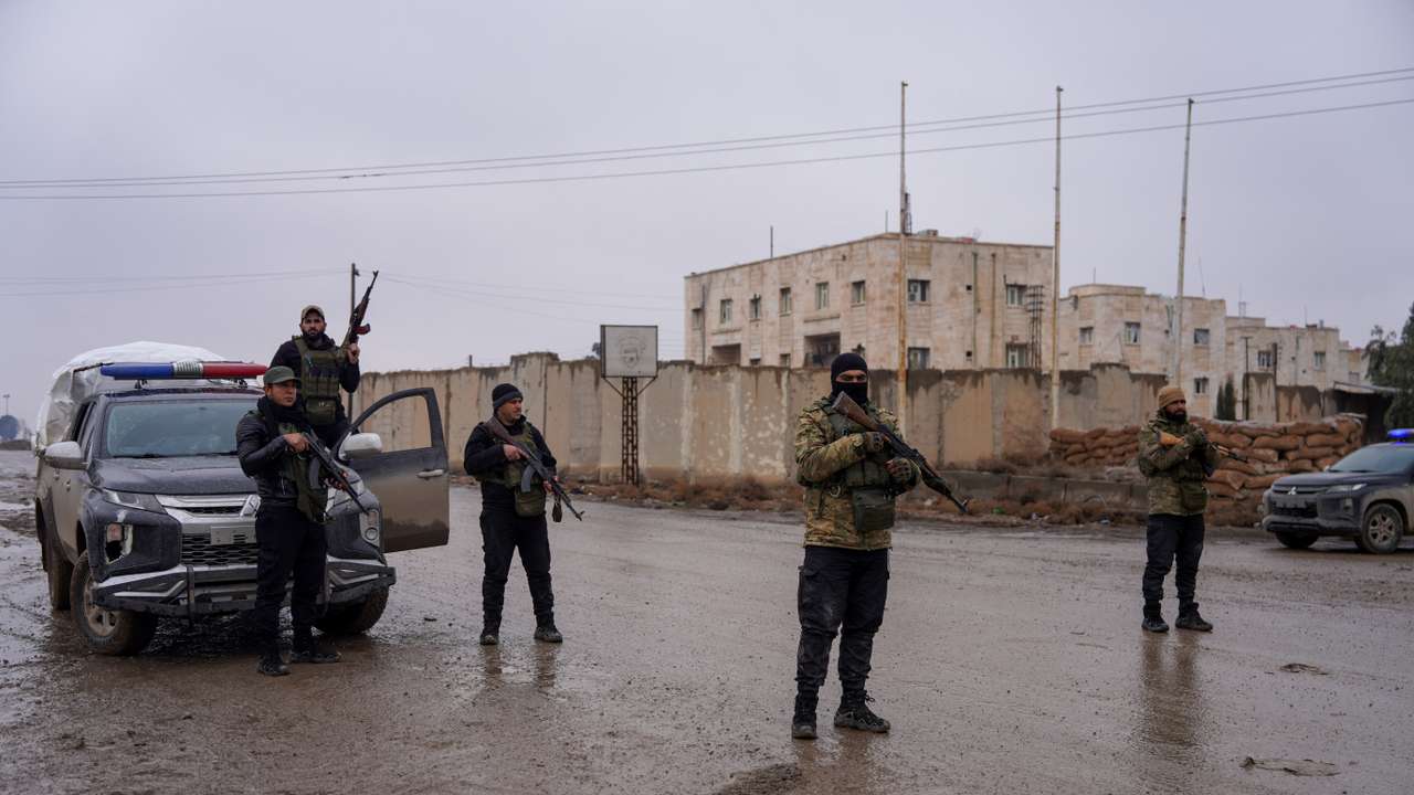 Syrian security forces outside al-Aqtan prison, where some Islamic State detainees are held, in Raqqa