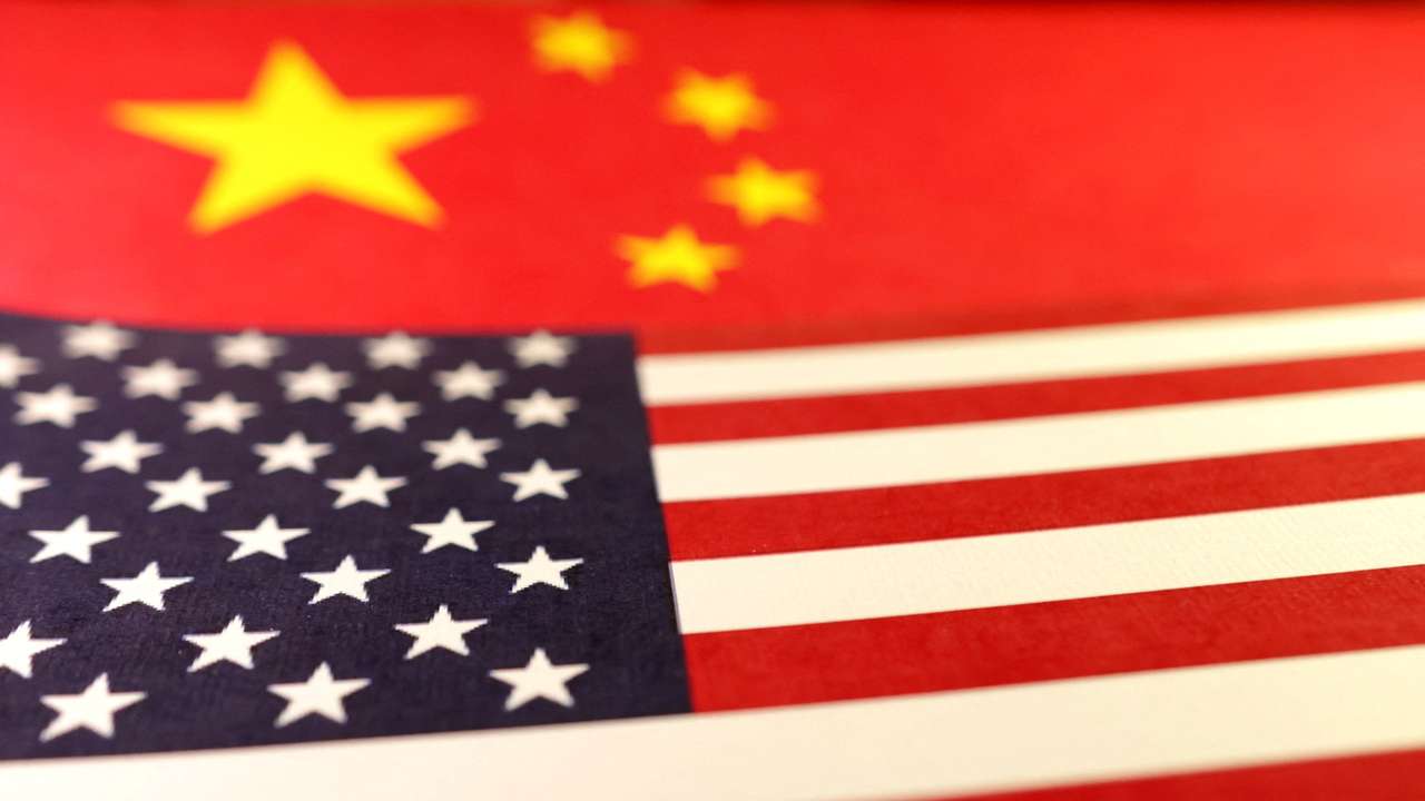Illustration shows U.S. and Chinese flags
