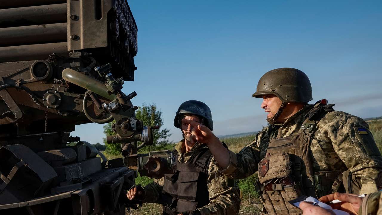 Ukrainian service members prepare to fire a RM-70 Vampire multiple launch rocket system towards Russian troops, at a position near a front line in Donetsk region