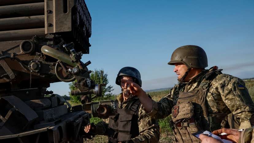 Ukrainian service members prepare to fire a RM-70 Vampire multiple launch rocket system towards Russian troops, at a position near a front line in Donetsk region