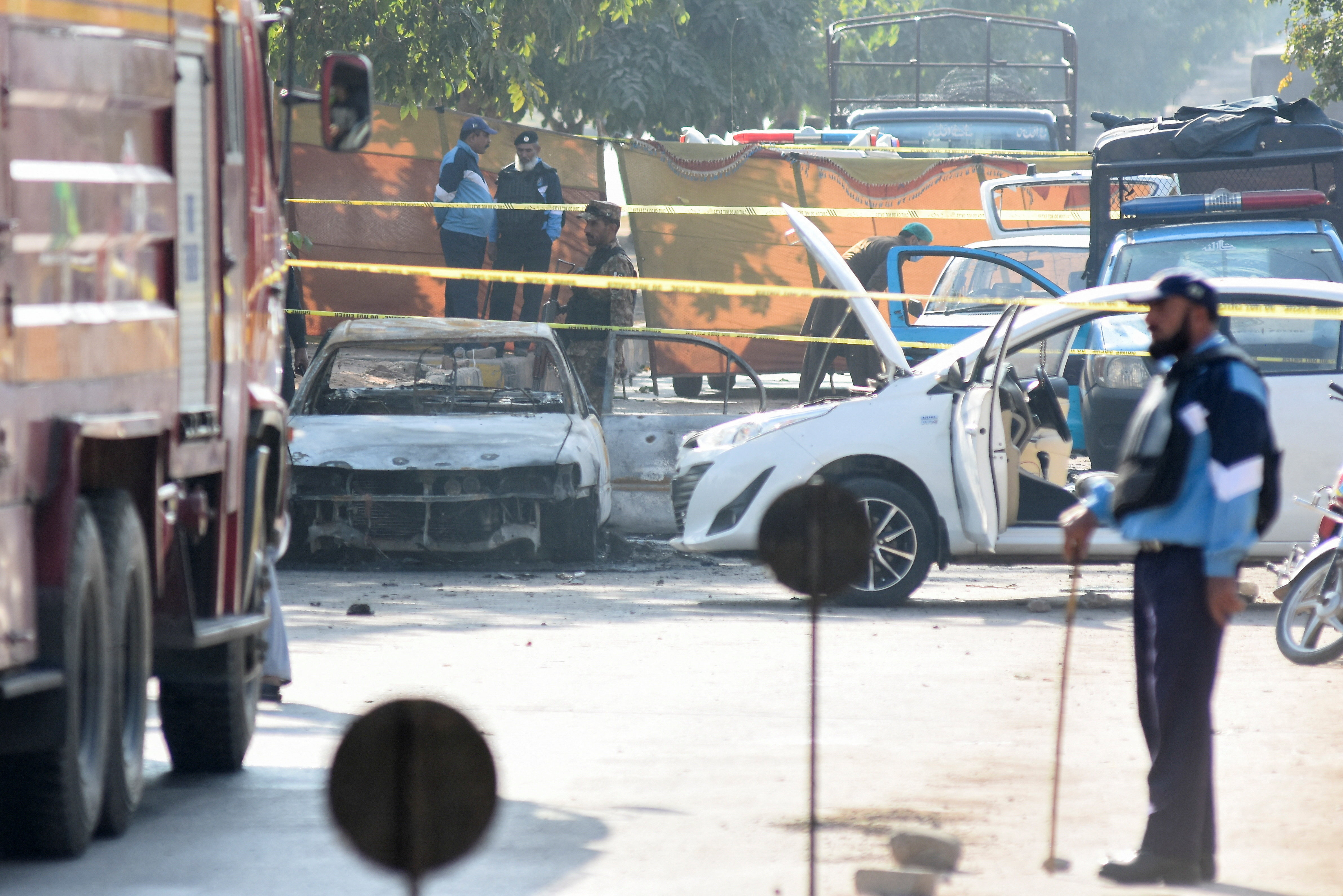A police officer stands at the site of a blast outside a court building in Islamabad