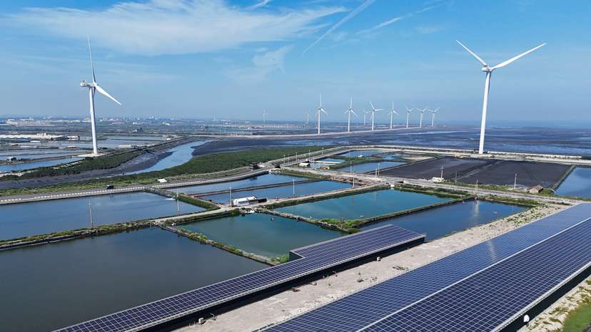 Wind turbines and solar panels are pictured in Changhua