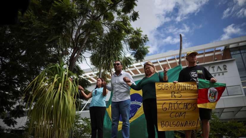 Supporters of former President Jair Bolsonaro gather in front of the DF Star Hospital where he underwent surgery in Brasilia