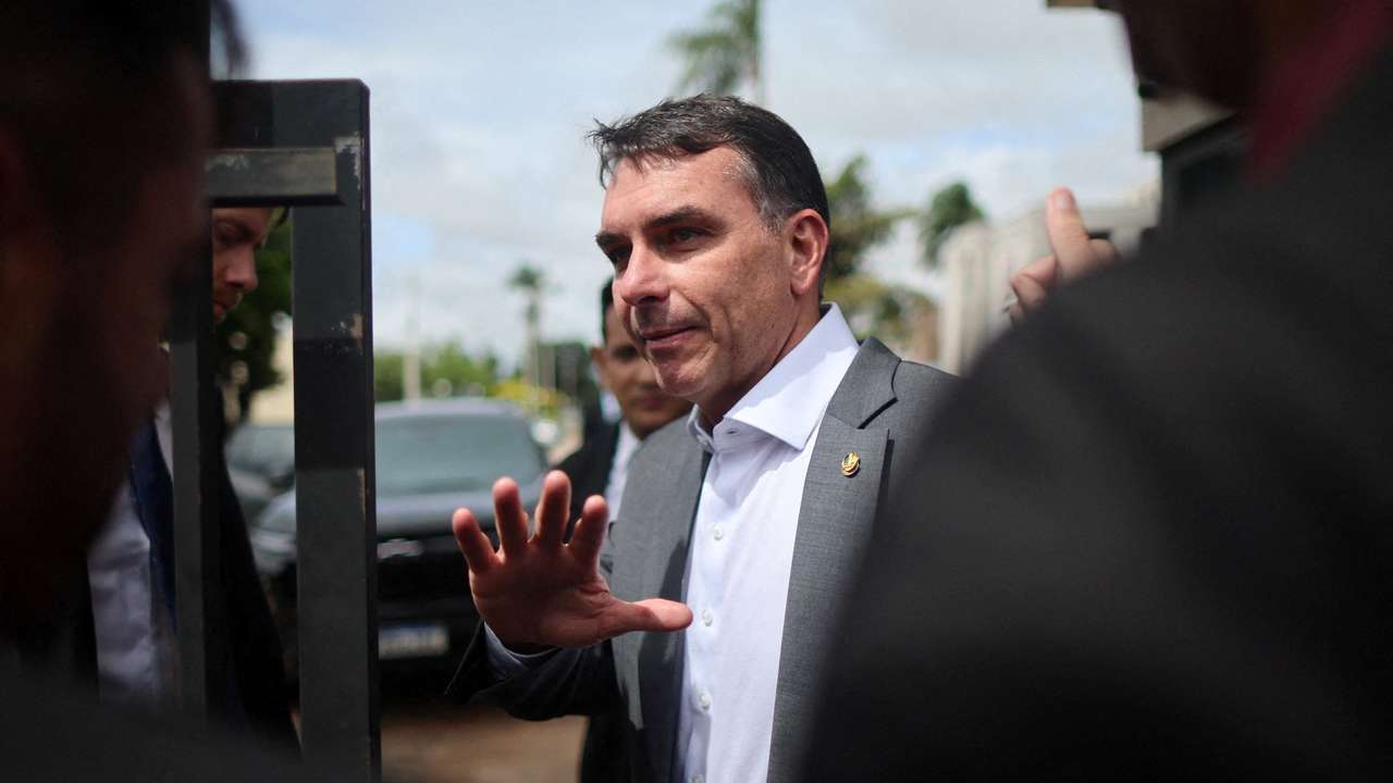 Senator Flavio Bolsonaro visits his father, former President Jair Bolsonaro, at a Federal Police building in Brasilia