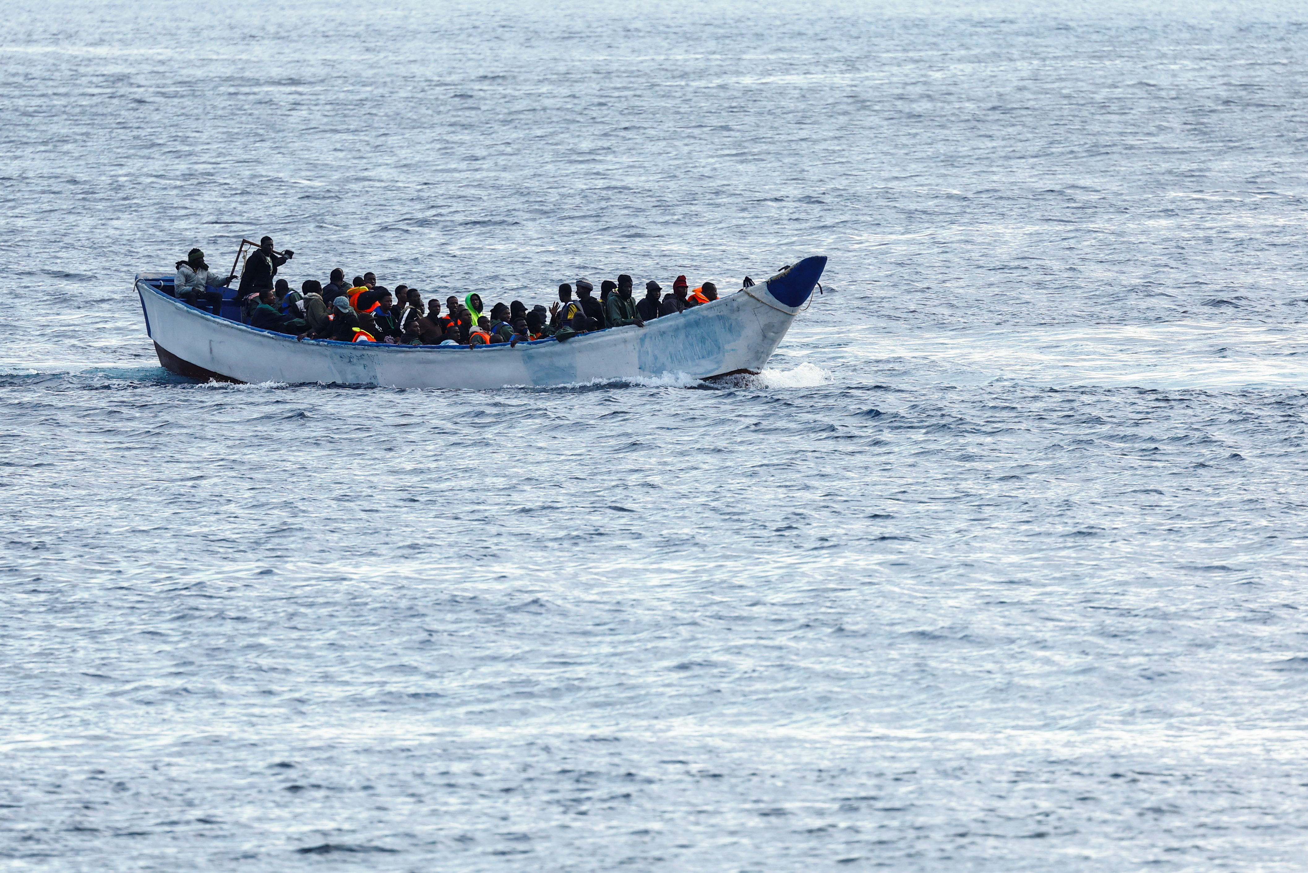 A fibreglass boat with migrants si seen arriving at the port of La Restinga on the island of El Hierro