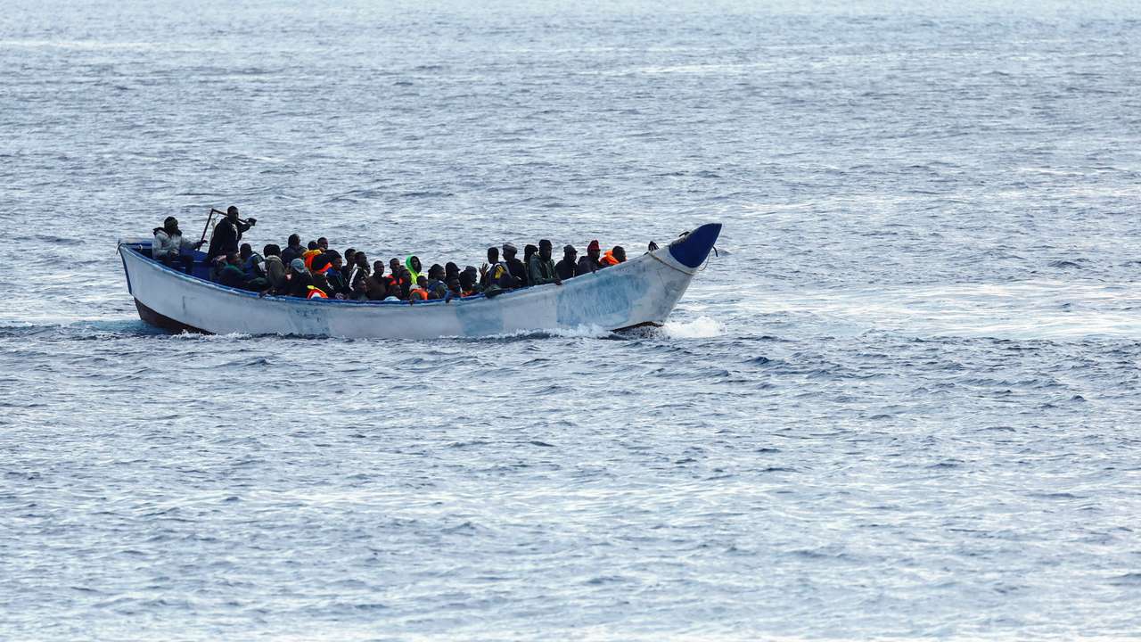 A fibreglass boat with migrants si seen arriving at the port of La Restinga on the island of El Hierro