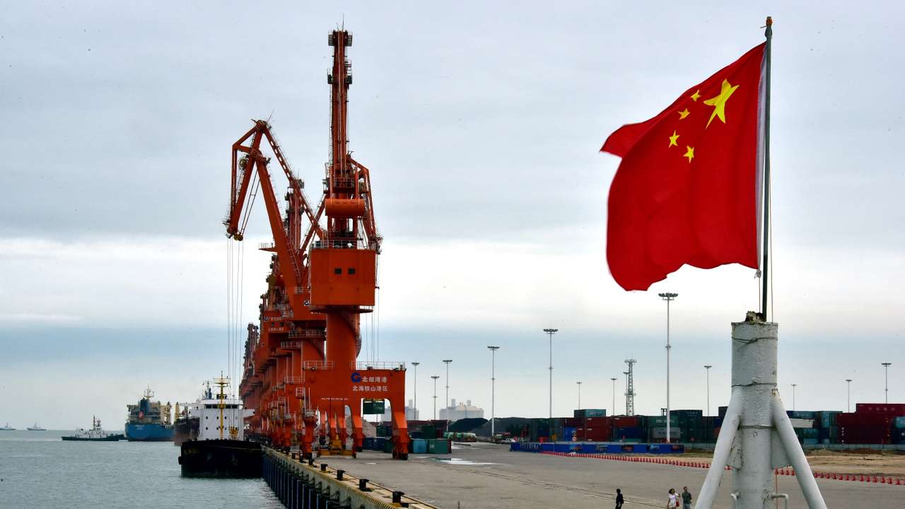 A Chinese national flag flies at a port in Beihai