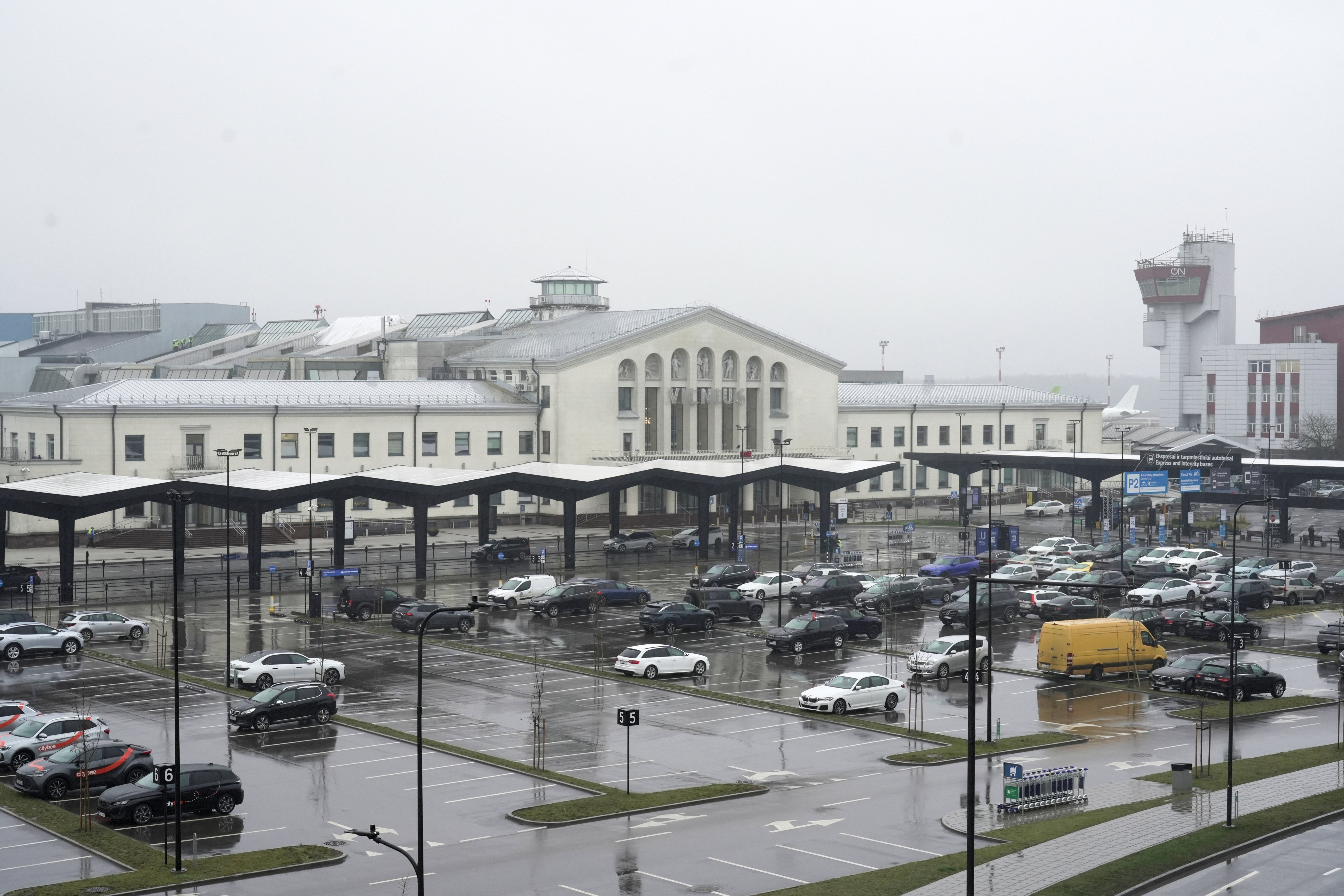Cars wait in front of the arrival terminal at Vilnius Ciurlionis International Airport in Vilnius